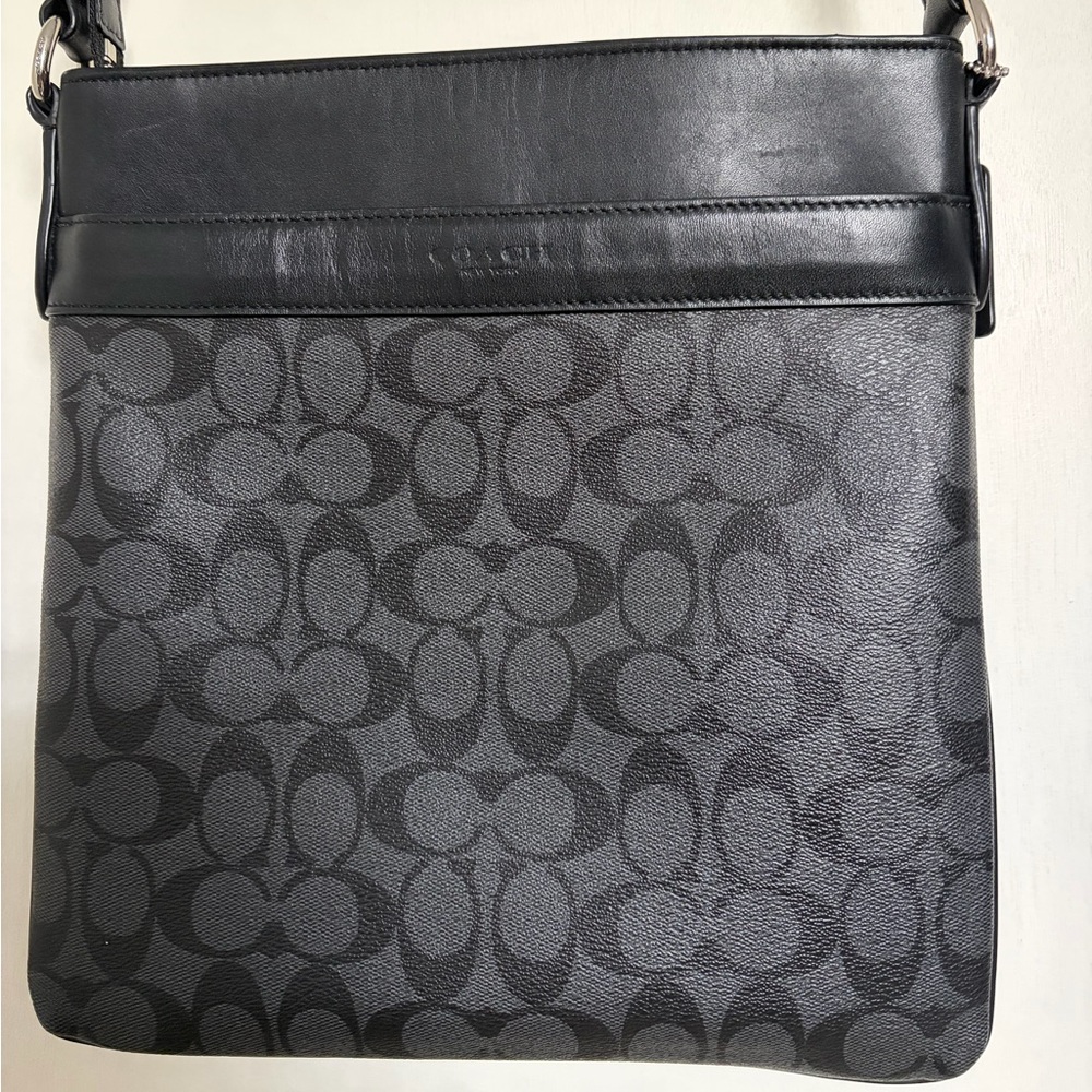 Coach Signature Black Crossbody Messenger bag with adjustable strap.